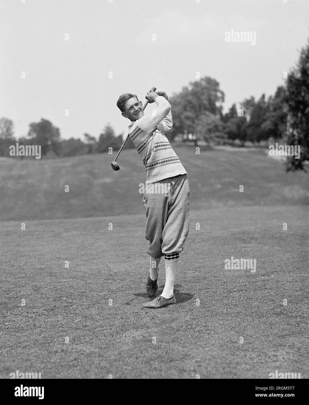 Golfer Samuel Parks driving a golf ball ca. 1925 Stock Photo