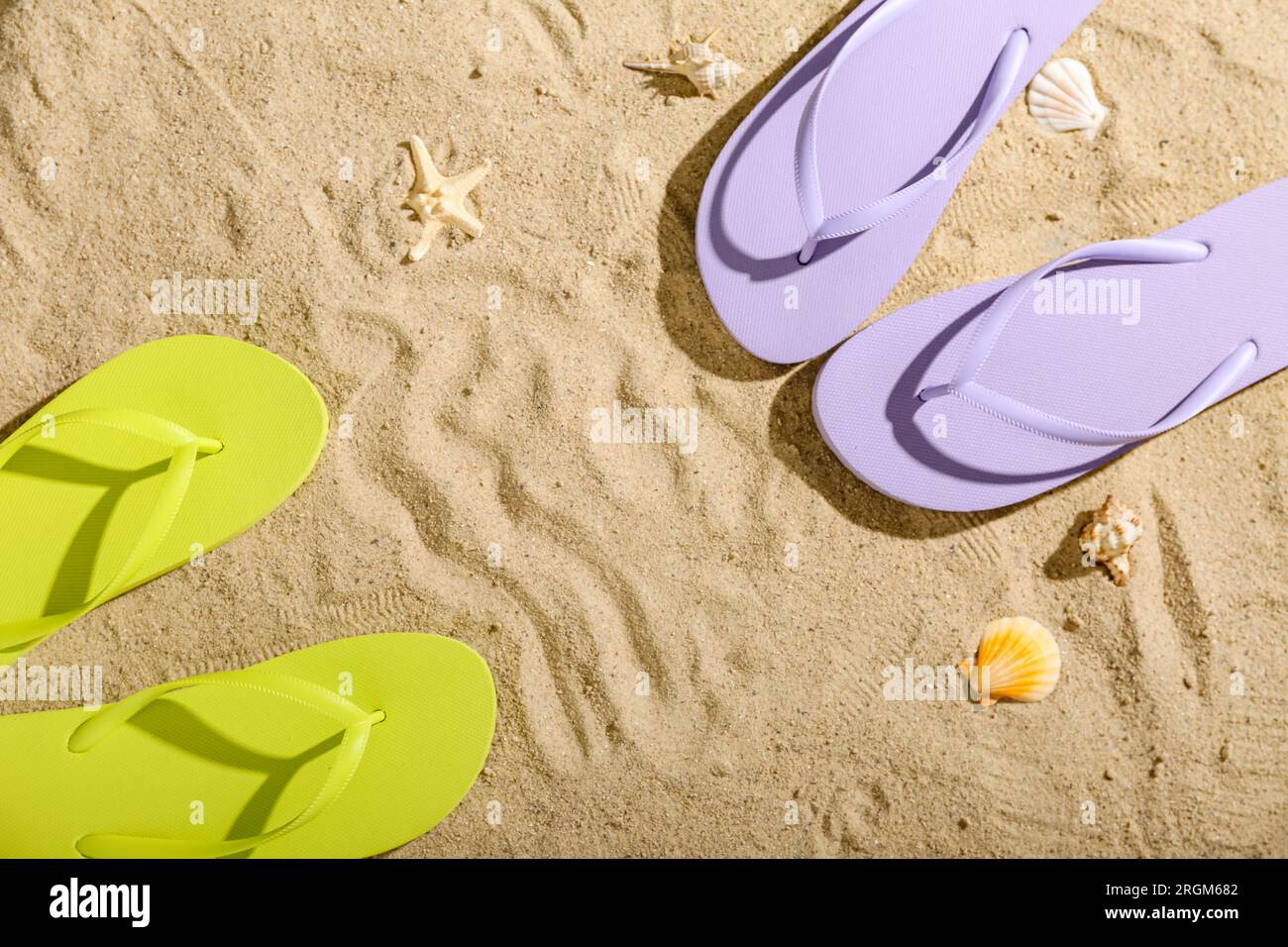 Frame made of colorful pairs of flip flops on sandy background Stock ...