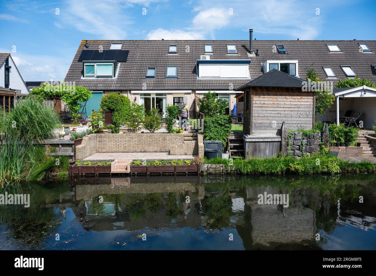 Barendrecht, South Holland, The Netherlands, July 4, 2023 - House with backyard in a small creek Stock Photo