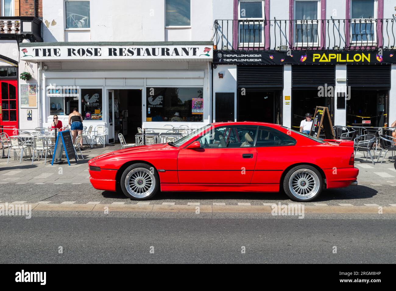 BMW 8 Series (E31) 1990s grand tourer parked on Marine Parade seafront road in Southend on Sea, Essex, UK. First generation BMW E31 coupe automobile Stock Photo
