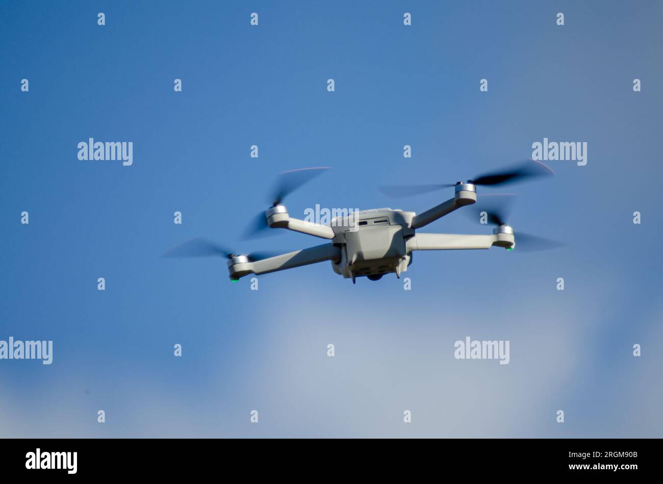 vigo, españa 07-31-2023 a DJI Mavic Mini 3 drone in flight, blue sky in the background. Stock Photo