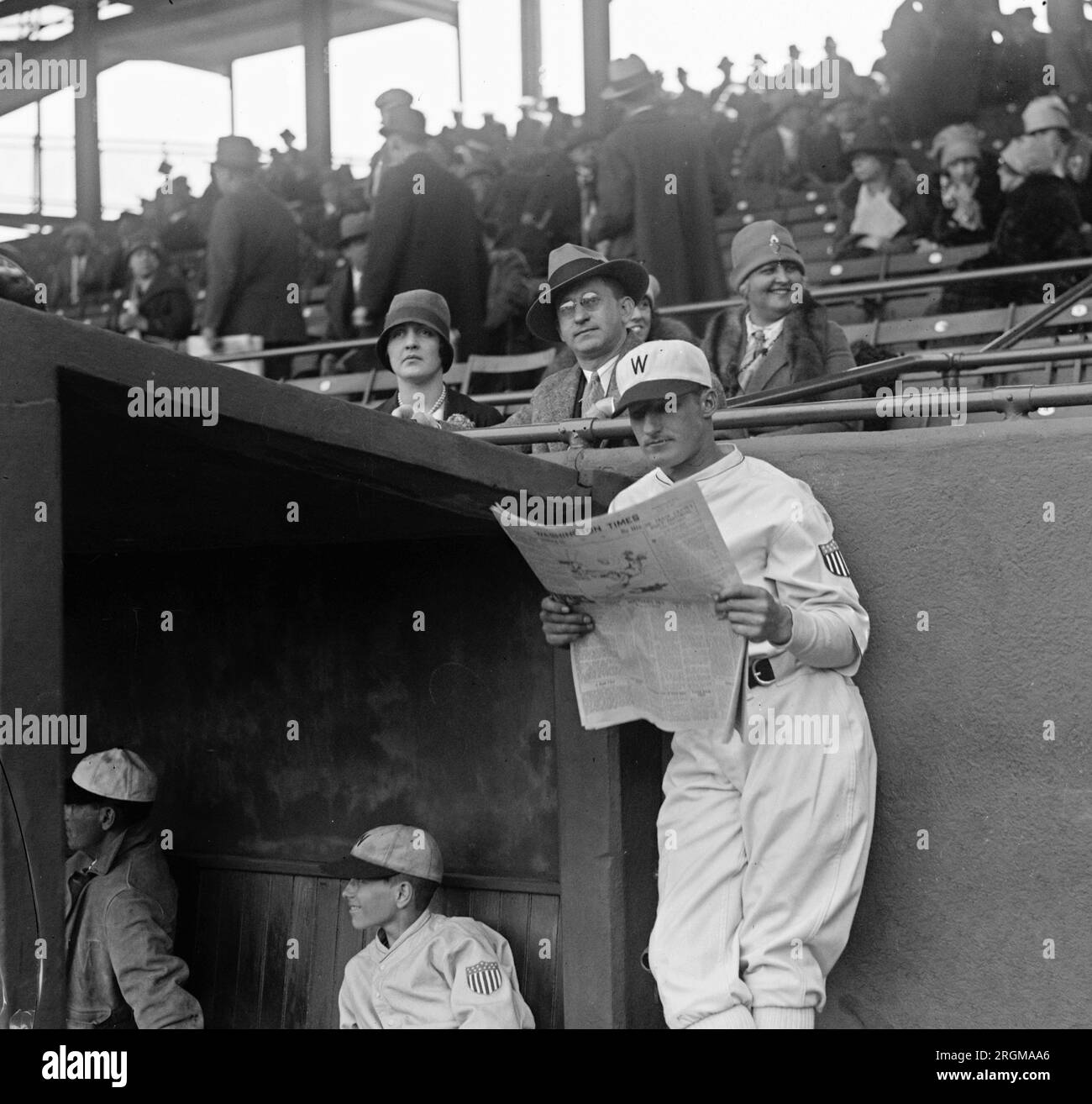 Babe Ruth in baseball uniform standing in dugout Stock Photo - Alamy