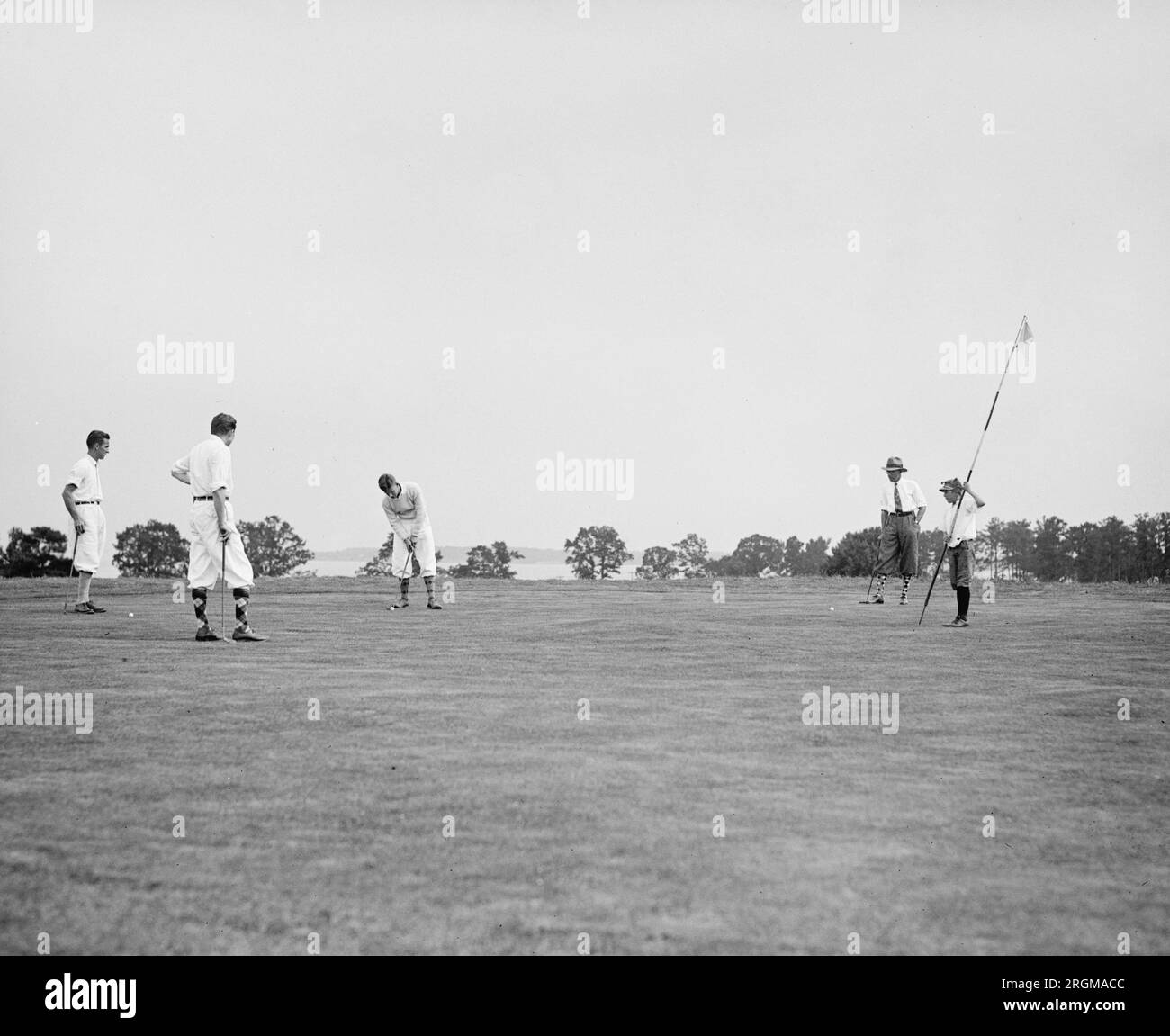 Foursome on the 18th green at Gibson Island golf course ca. 1926 or 1927 Stock Photo