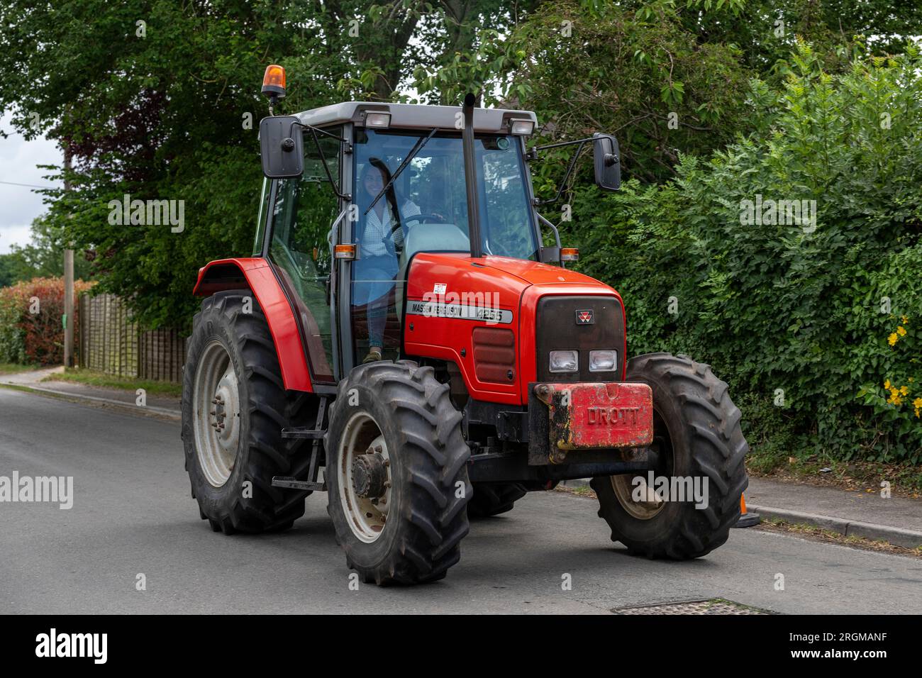 Modern red tractor with a cab hires stock photography and images Alamy