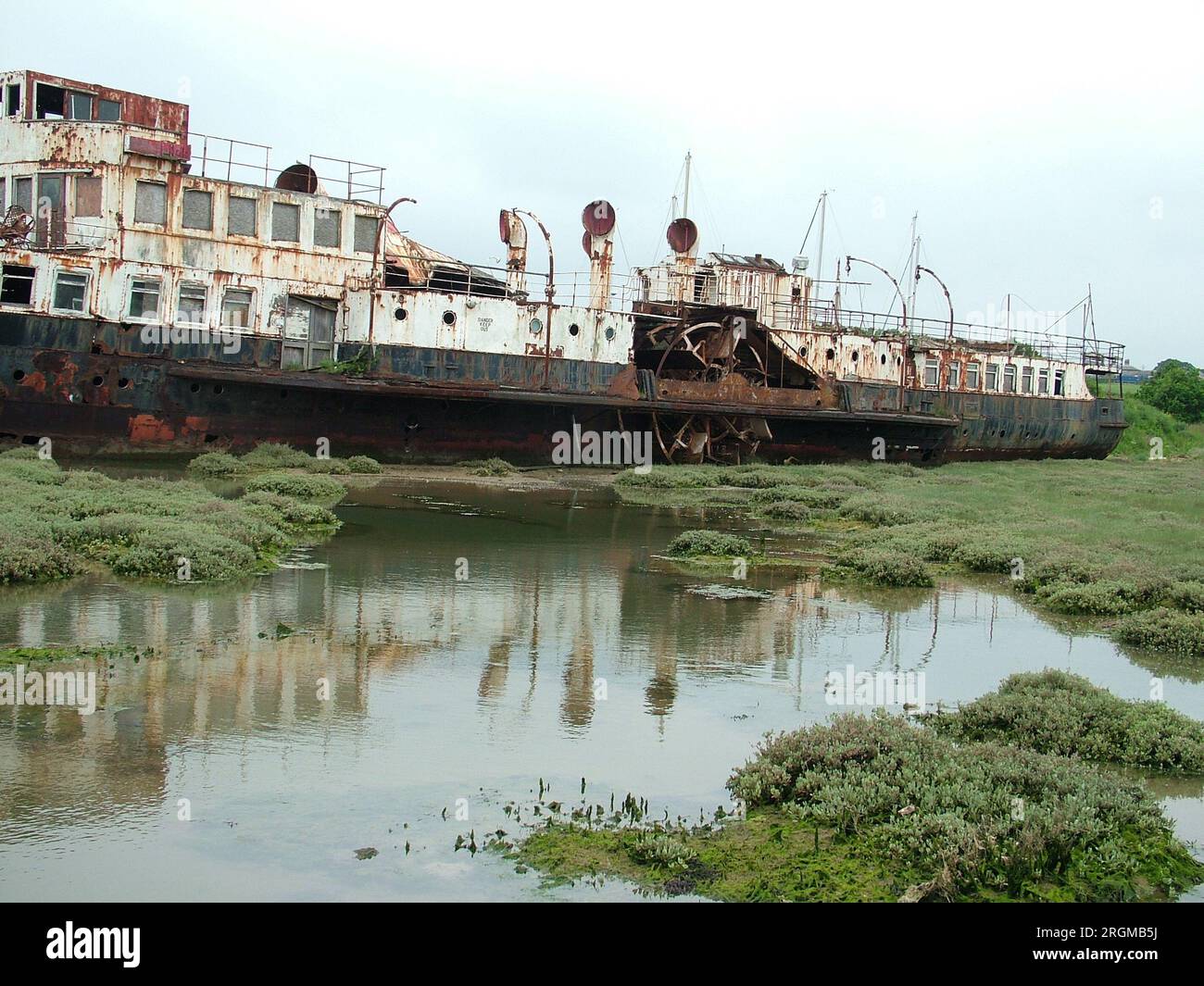 The paddle steamer Ryde derelict and rusting on tidal flats on the Isle