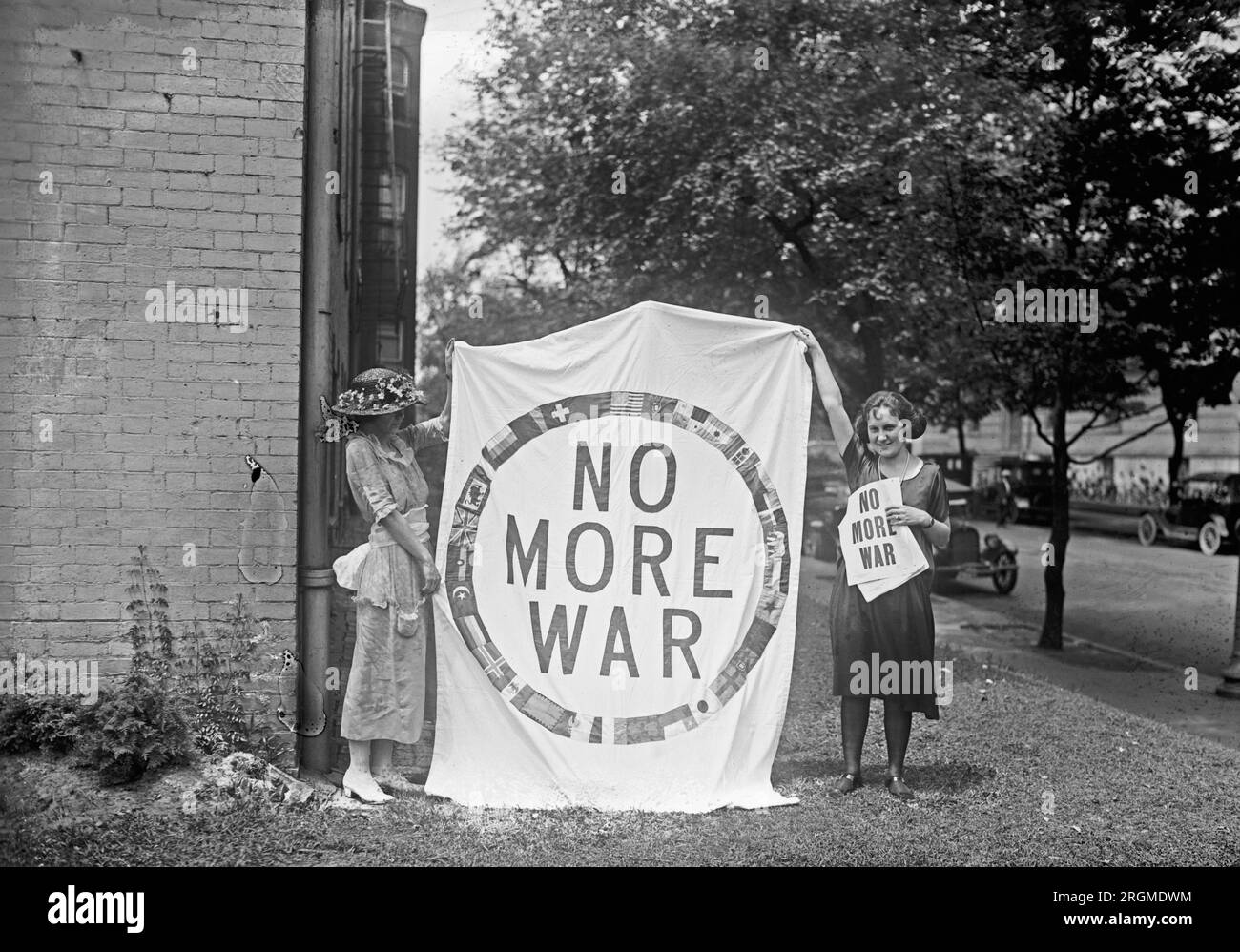 Two women from the National Council Limitation of Armaments group, holding up a 'No More War' banner ca. 1922 Stock Photo