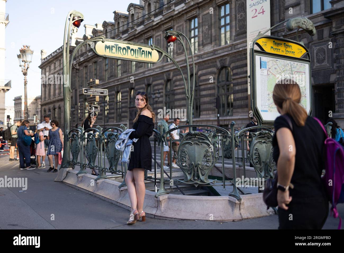 Paris, France. 10th Aug, 2023. A woman waits at a parisian metro entrance, Louvre museum and rivoli area in Paris, during the summer on August 10, 2023. Photo by Raphael Lafargue/ABACAPRESS.COM Credit: Abaca Press/Alamy Live News Stock Photo