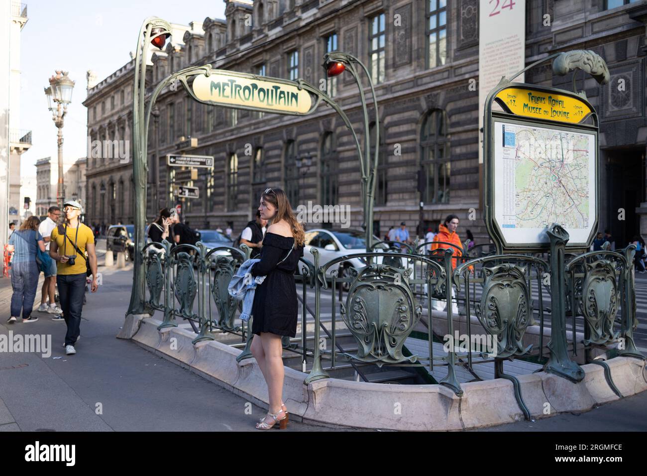 Paris, France. 10th Aug, 2023. A woman waits at a parisian metro entrance, Louvre museum and rivoli area in Paris, during the summer on August 10, 2023. Photo by Raphael Lafargue/ABACAPRESS.COM Credit: Abaca Press/Alamy Live News Stock Photo
