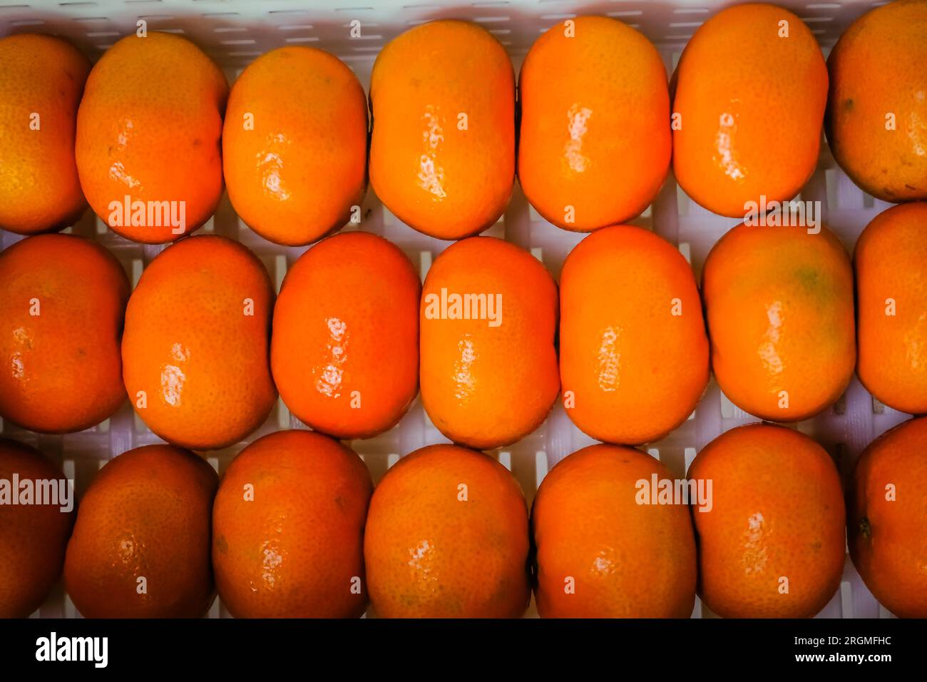 clementines inside a white basket Stock Photo Alamy