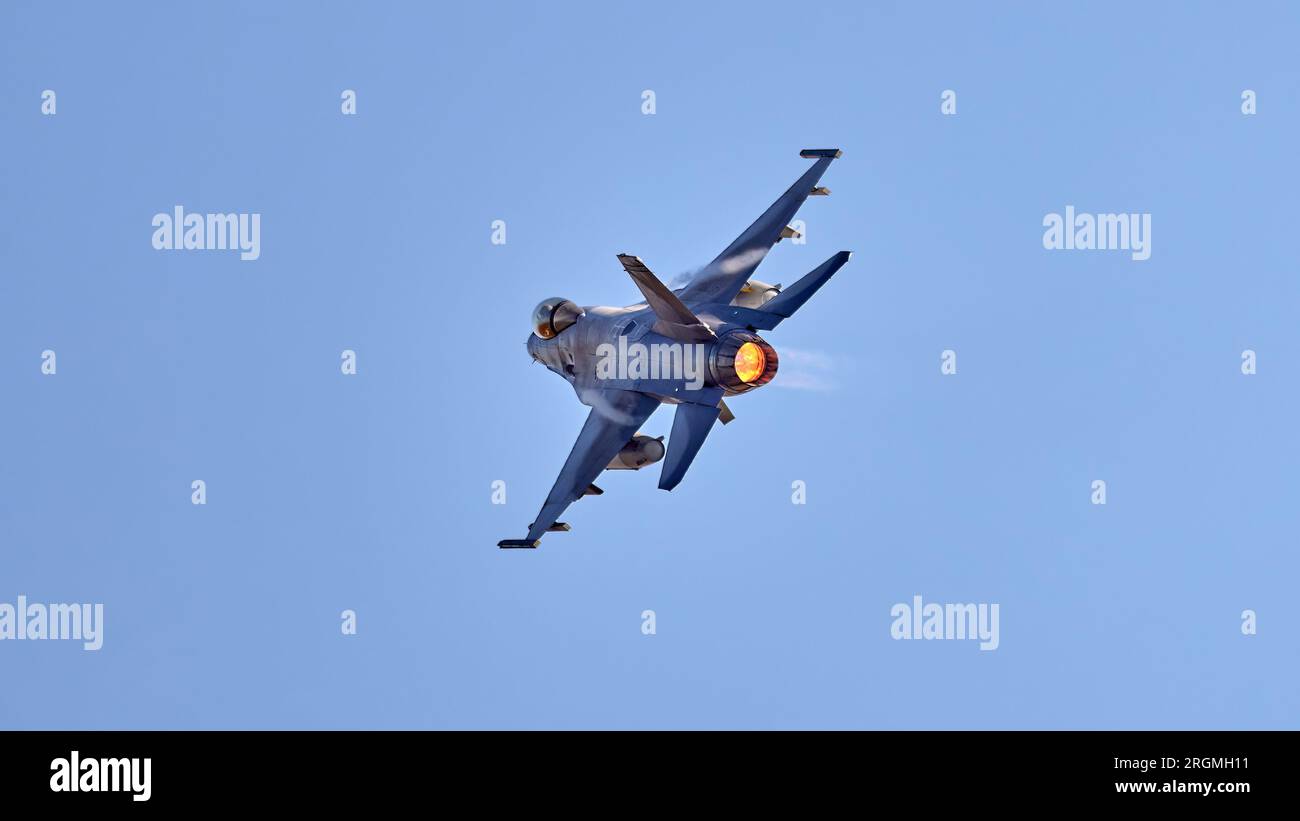 The Sonic Boom Generated By An F-16 Flying Supersonic.F-16 Fighting Falcon. Air force fighter jet plane in full flight. Stock Photo