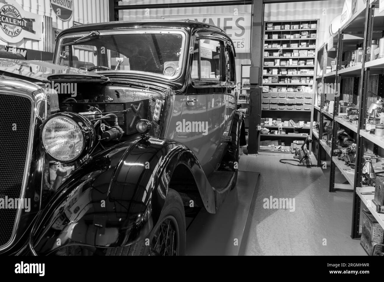 Sparkford.Somerset.United Kingdom.March 26th 2023.A 1938 Morris Eight Saloon is on show in an old fashioned garage a the Haynes Motor Museum in Somers Stock Photo