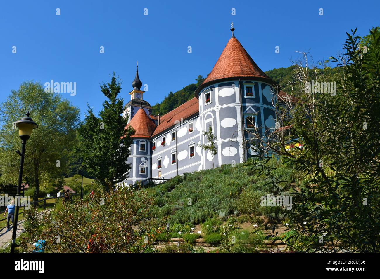 View of old medieval monastery complex at Olimje near Podcetrtek in Stajerska, Slovenia and a herb garden in front Stock Photo