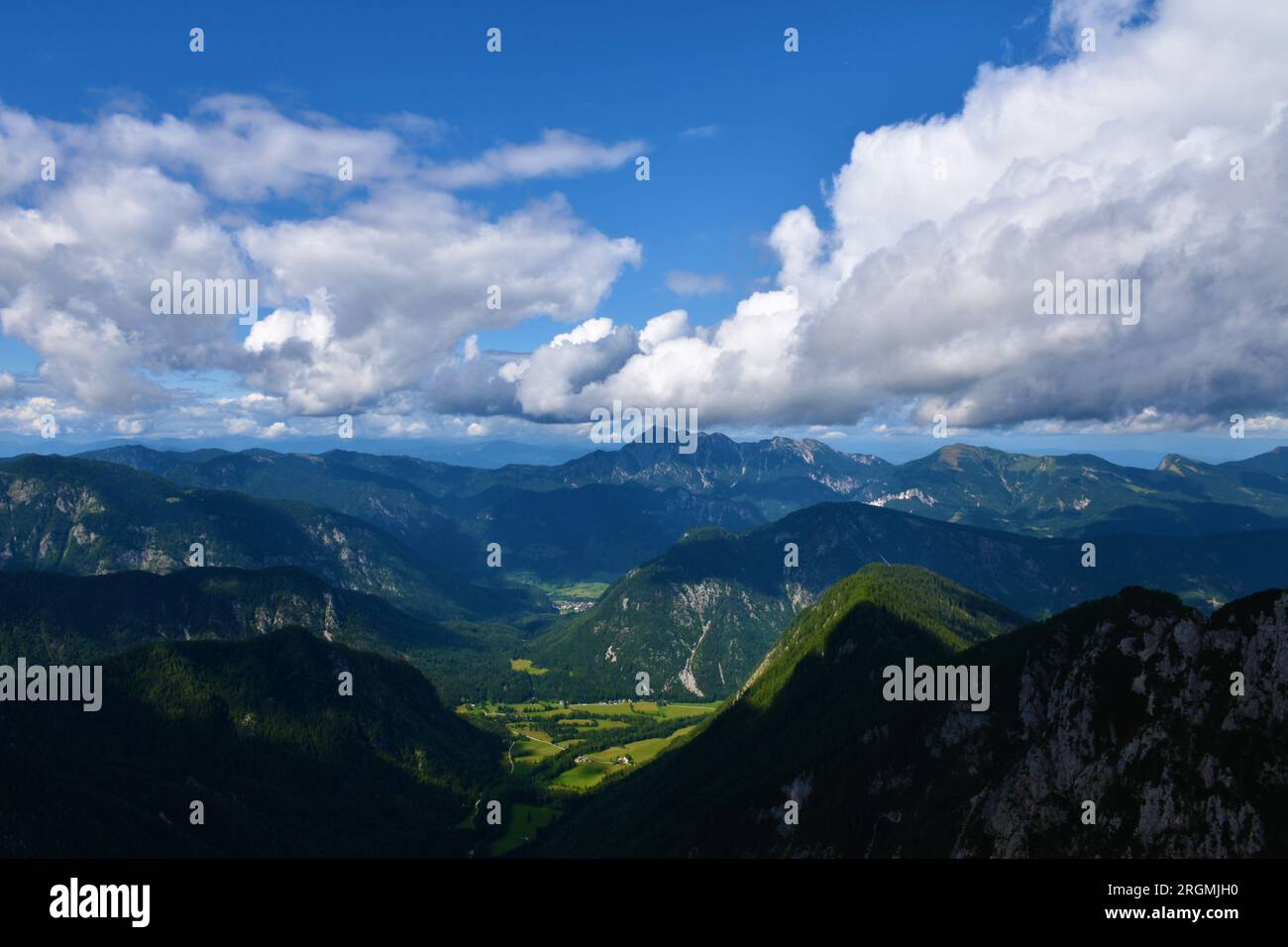 Scenic view of Radovna valley and Kepa mountain in Karavanke mountain range in Gorenjska, Slovenia with clouds in the sky Stock Photo