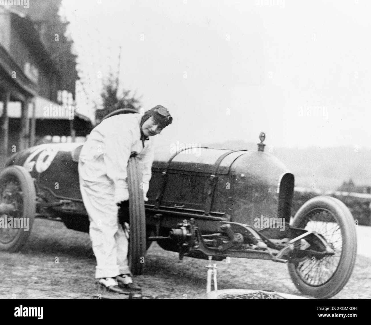 Vintage Auto Racing Woman changing tire of Stutz Weightman Special no
