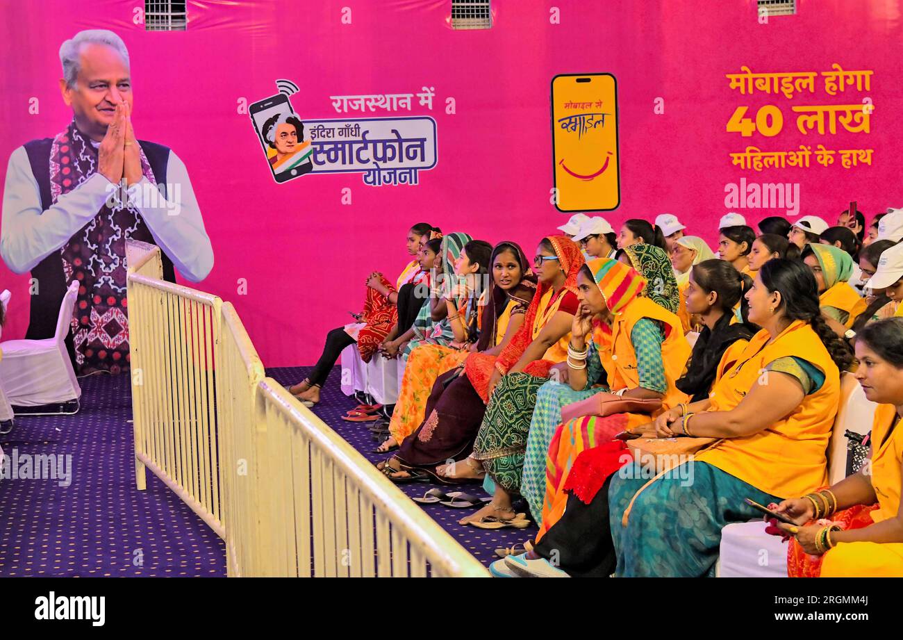Jaipur, India. 10th Aug, 2023. Beneficiaries looks poster of Rajasthan Chief Minister Ashok
