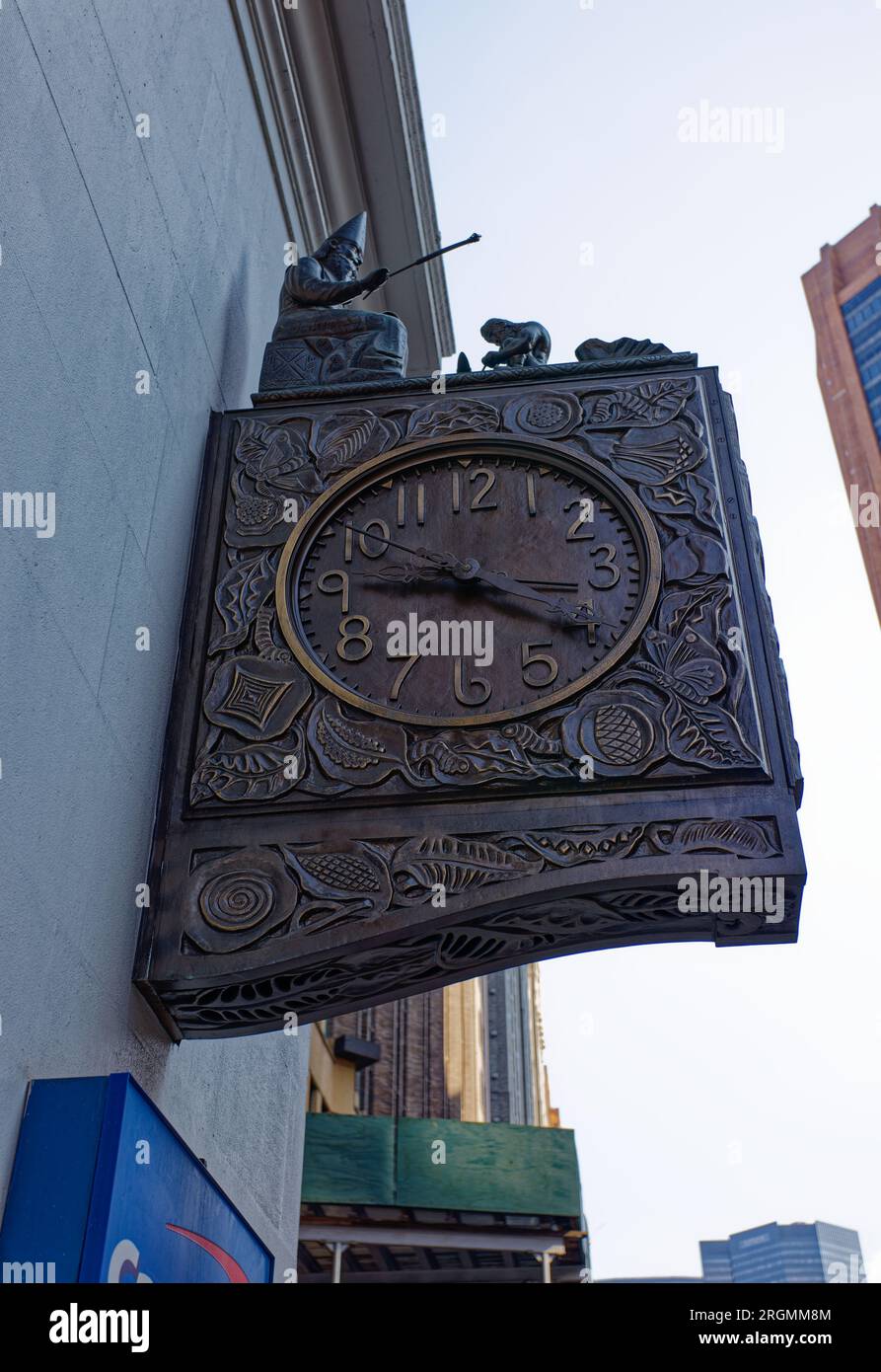 Midtown South: The Wizard of Park Avenue, perched atop The Silk Clock on the side of the Schwarzenbach Buildings, animates to strike the hour. Stock Photo