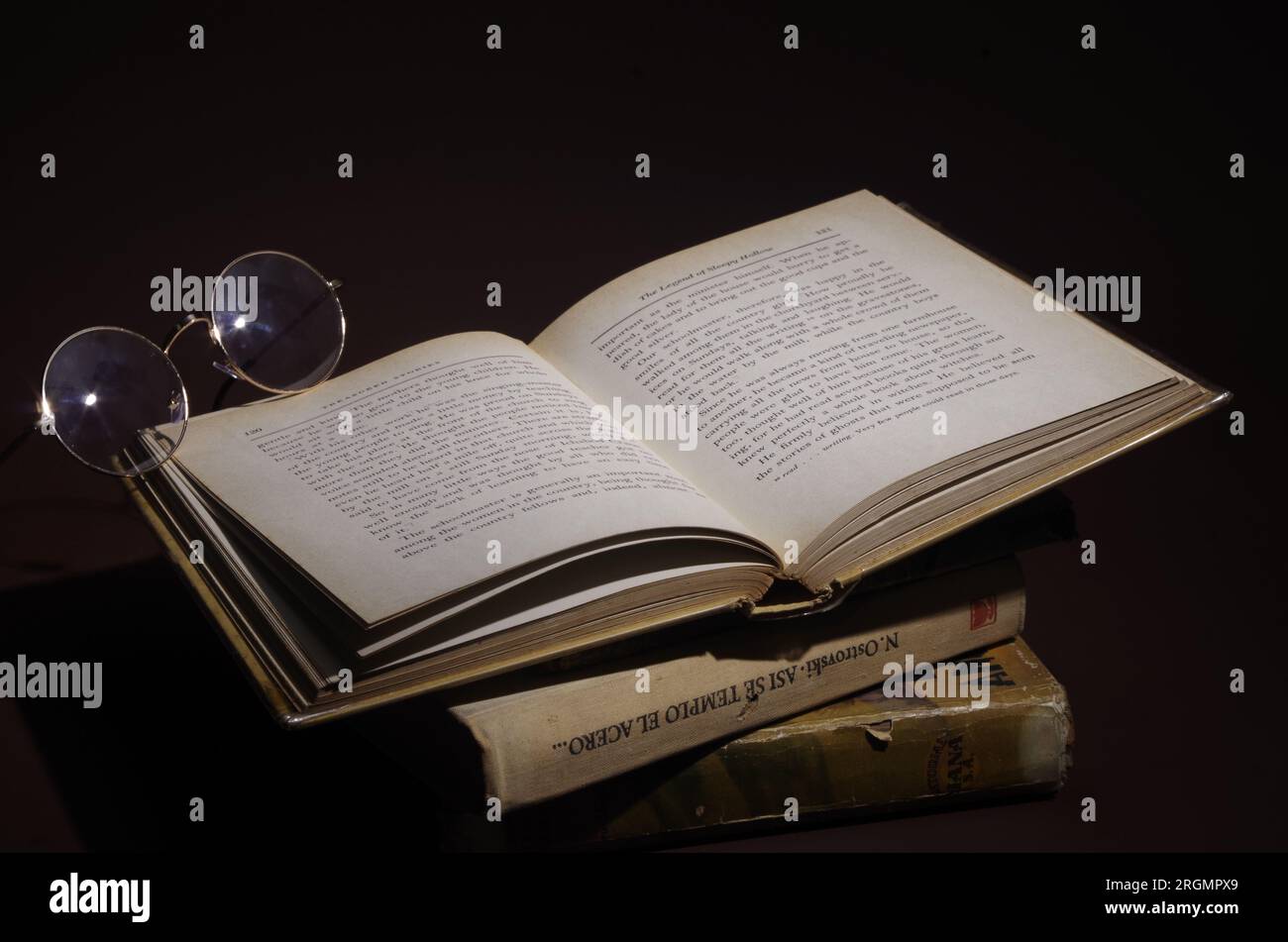 Book reading lenses and rose Stock Photo Alamy