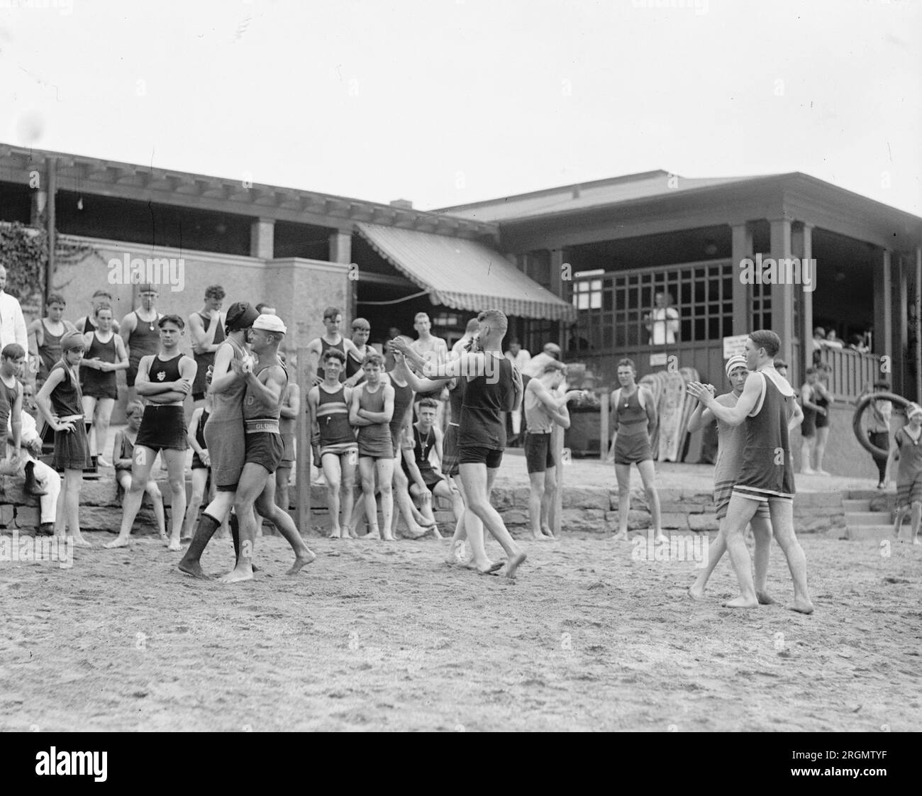 Young men and women dancing on a beach ca. 1922 Stock Photo