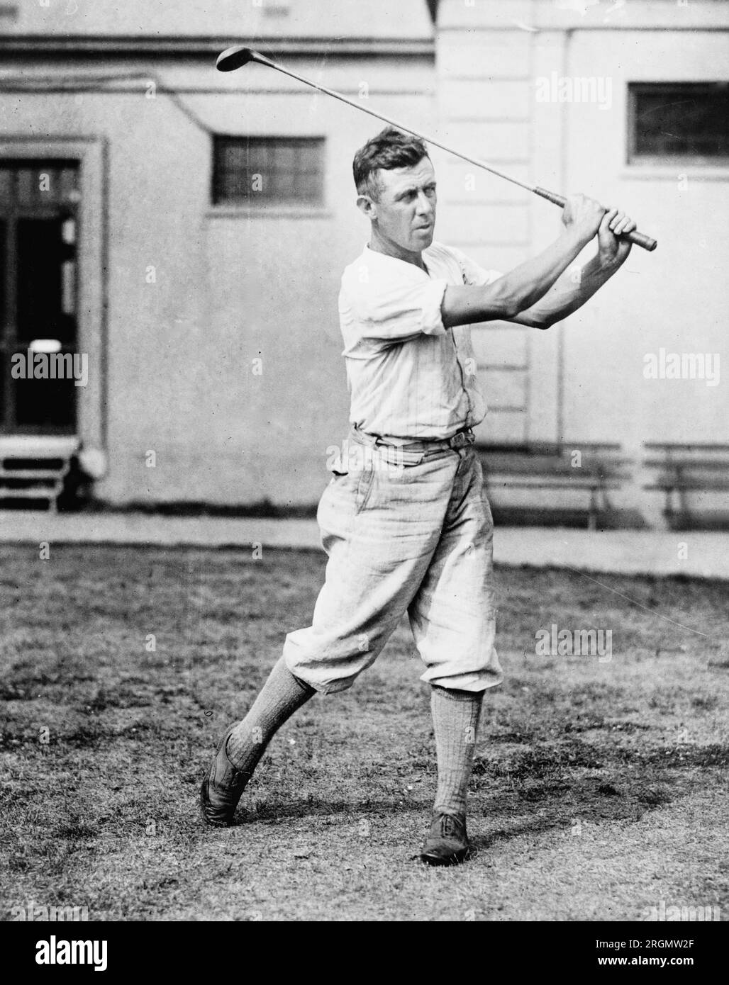 Vintage Golf: Man swinging golf club ca. 1909-1932 Stock Photo