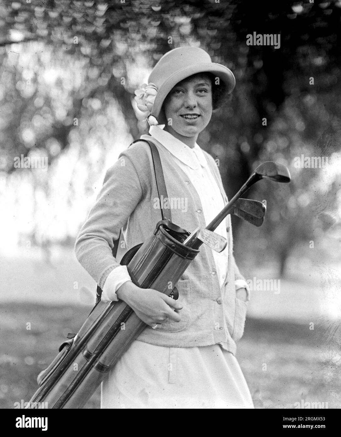 Miss Betty Ives holding a bag of golf clubs ca. 1923 Stock Photo
