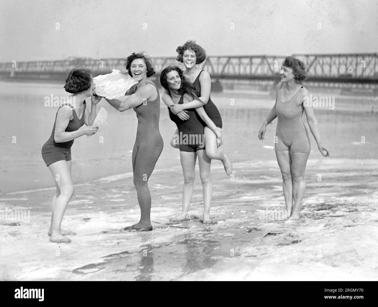 Five women in swimsuits on icy beach ca. 1924 Stock Photo