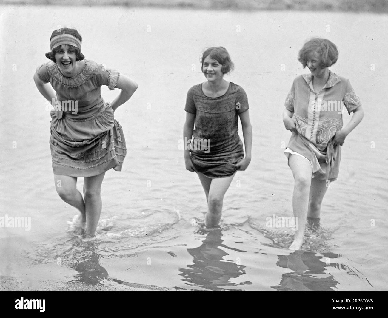 Female models from the Washington Fashion Show, wading in water ca ...