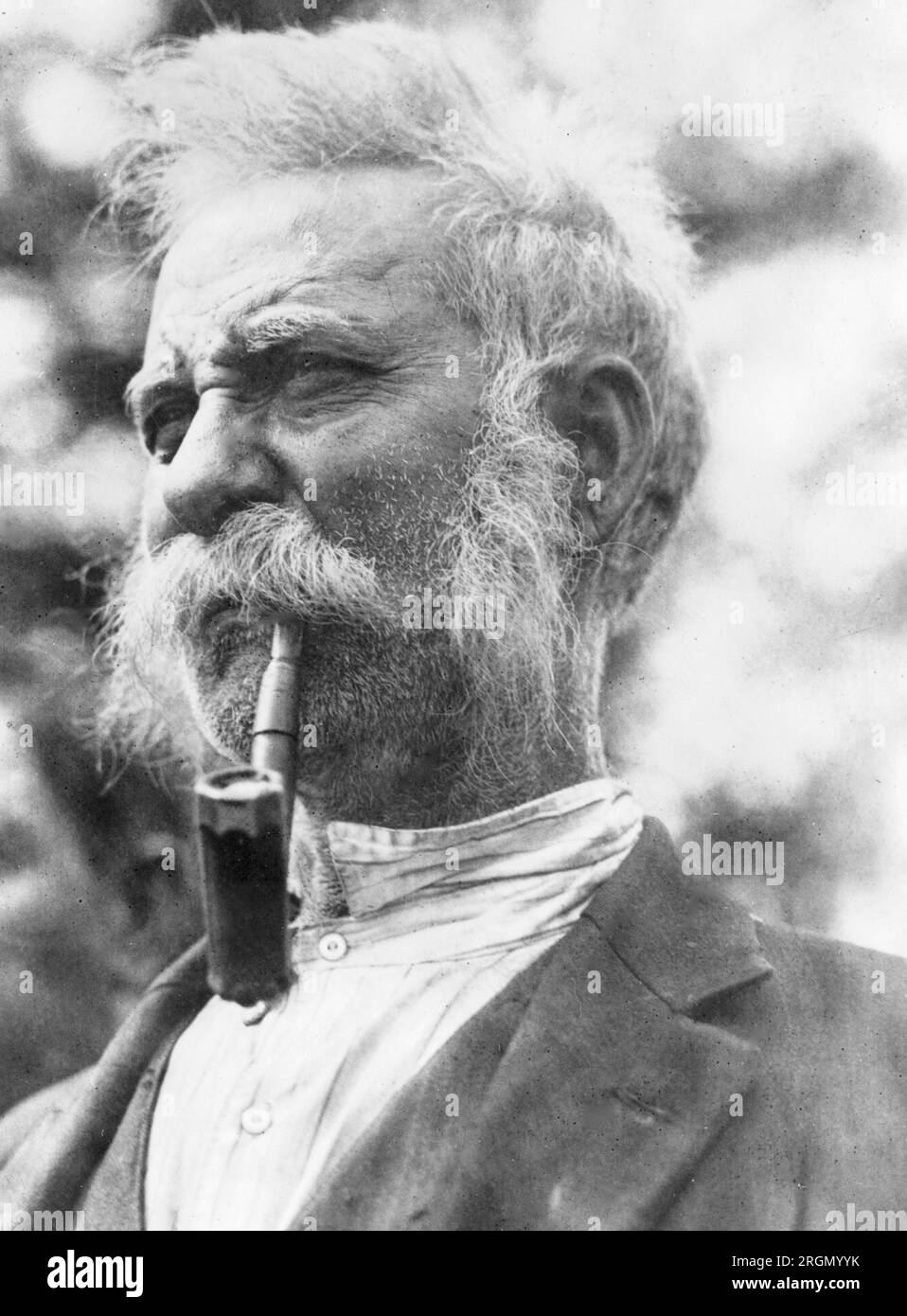 King John, leader of the Romany band of gypsies, head-and-shoulders portrait, facing left, with pipe in mouth ca. 1924 Stock Photo