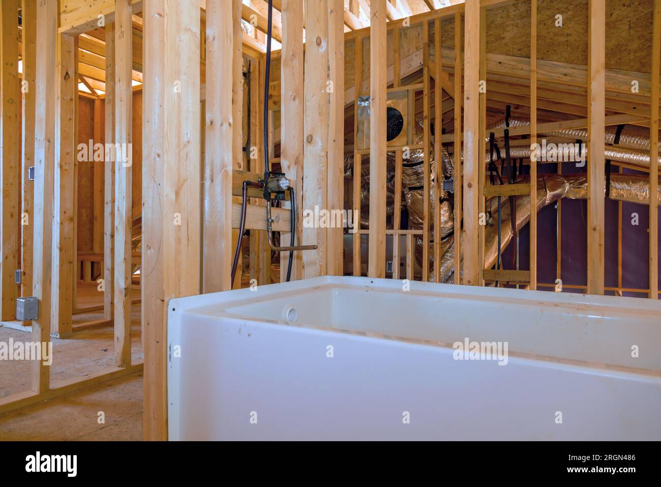 New acrylic bathtub installed in under construction home bathroom