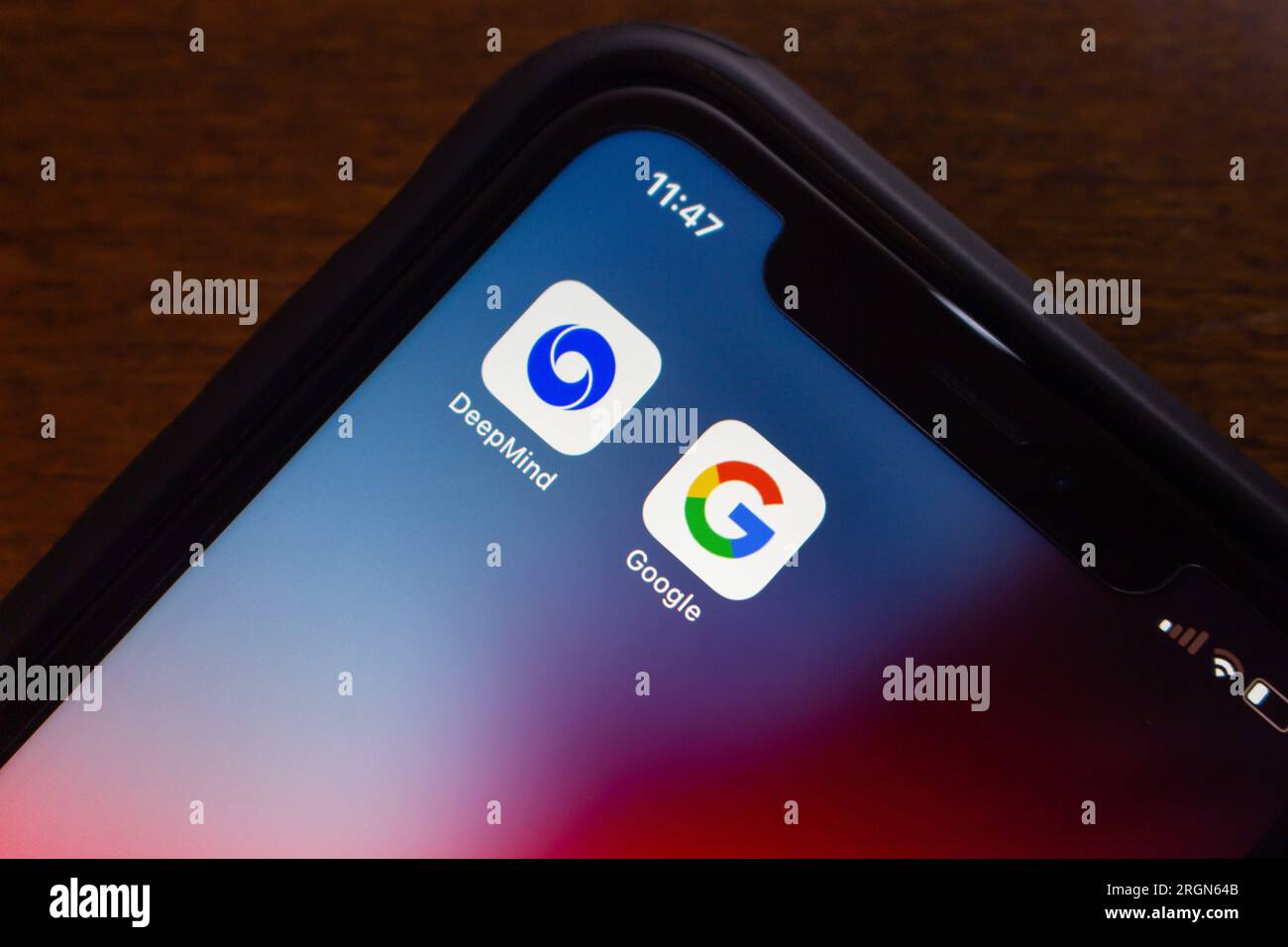 Icon of Google DeepMind, is a UK artificial intelligence research laboratory (a subsidiary of Google), with Google icon seen on an iPhone. Stock Photo