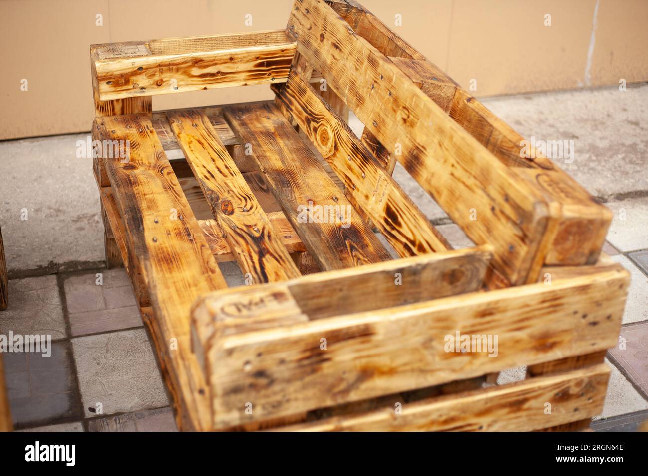 Bench made of boards. Craft furniture. Interior details. Cheap