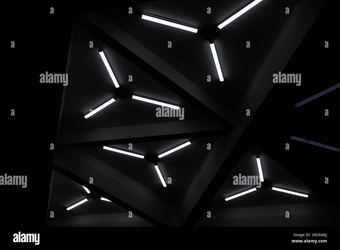 Triangular fluorescent lamps. Ceiling design. Interior details ...