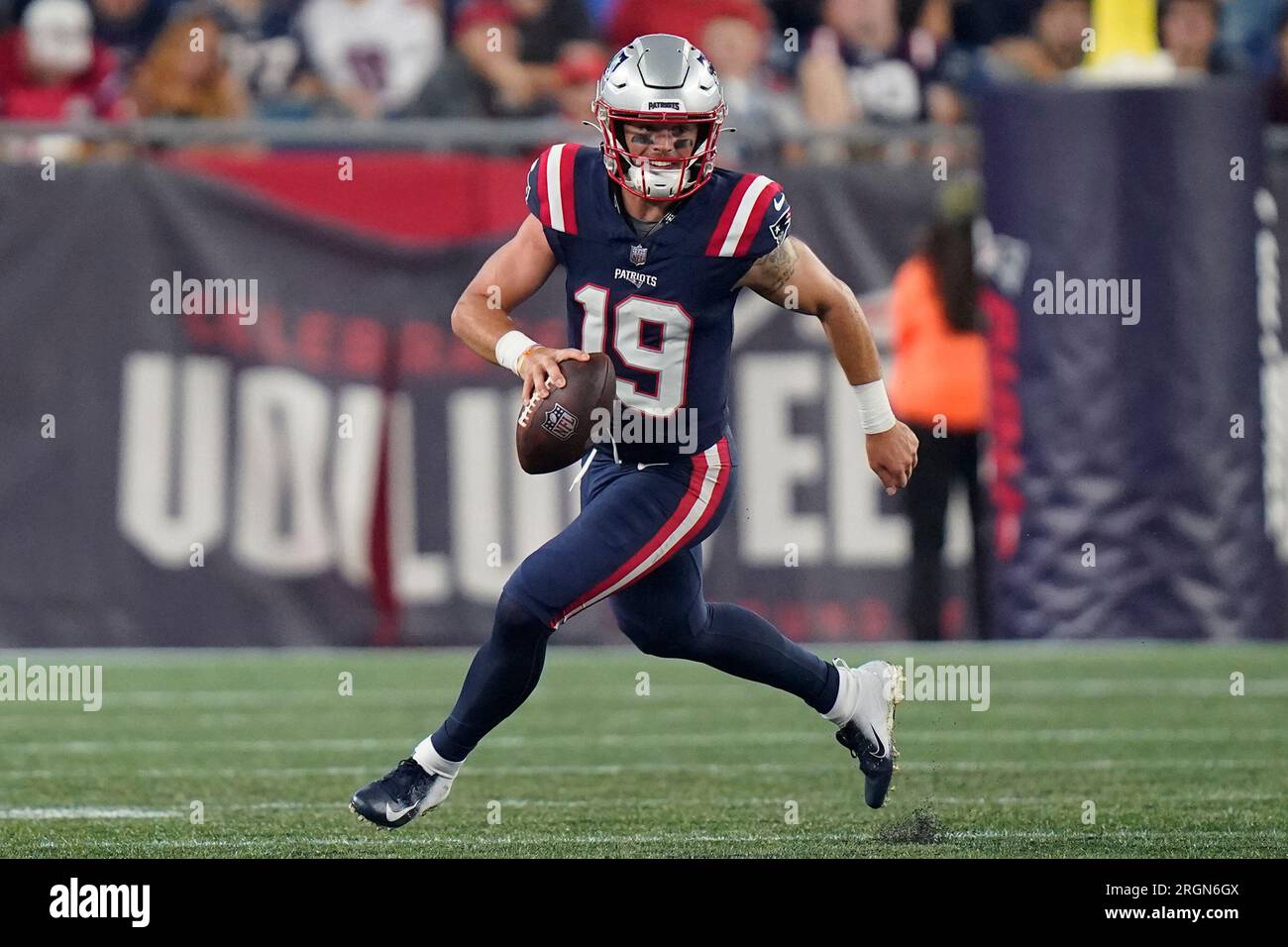 New England Patriots quarterback Trace McSorley scrambles while looking ...