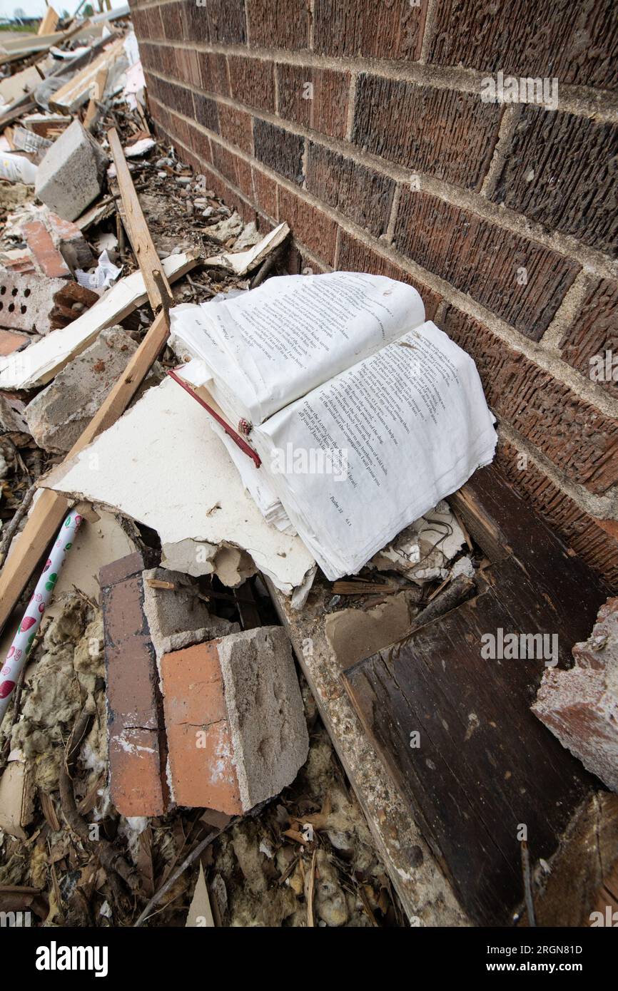 Reportage: USDA visit to survey EF4 tornado disaster area in Rolling Fork, MS, on April 12, 2023 - A large print Bible opened to Pslam 22 sits among the rubble outside a destroyed church. Stock Photo