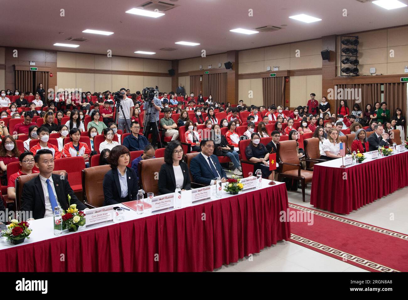 Reportage: USDA delegation with Secretary Tom Vilsack visits Vietnam (April 2023) - Audience members listen as Vilsack speaks at the Foreign Trade University in Hanoi where he participated in a Q & A and panel discussion for university faculty and students and agricultural industry leaders. Stock Photo