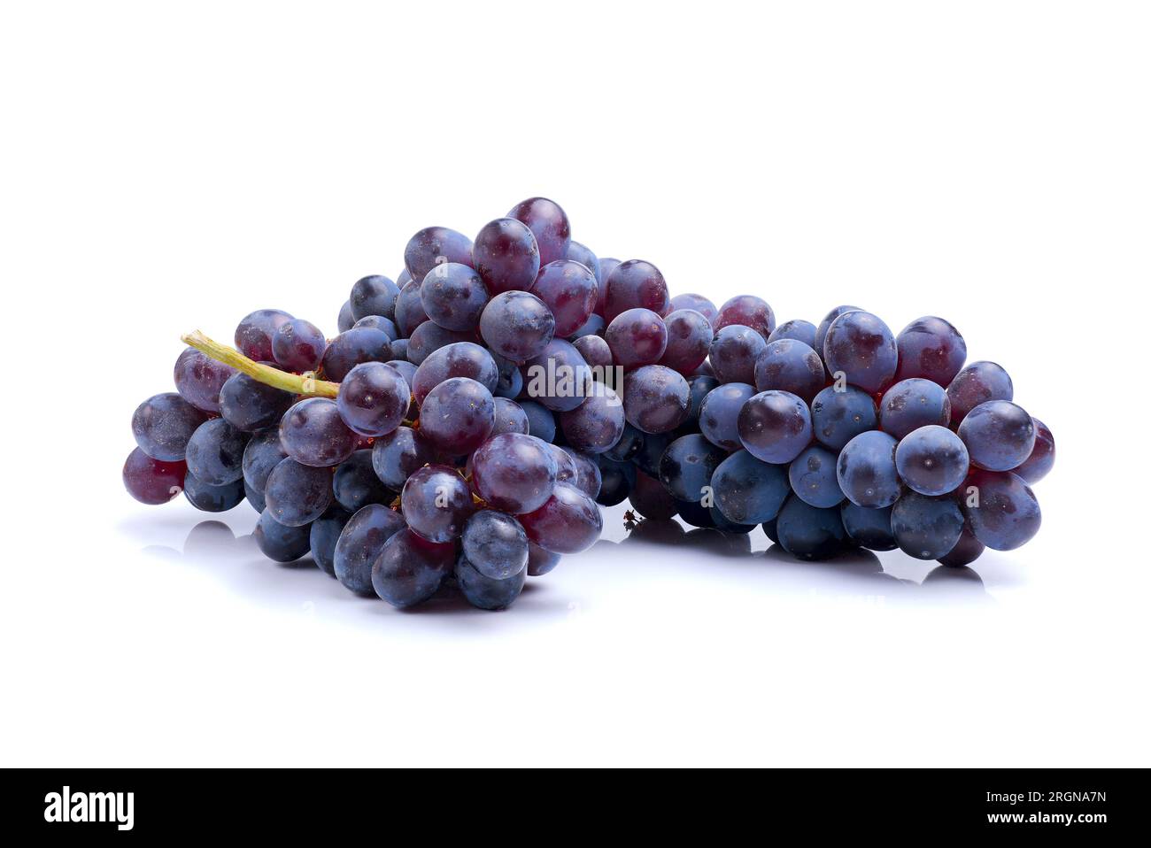 bunch of black kishmish grapes isolated on white background, full depth