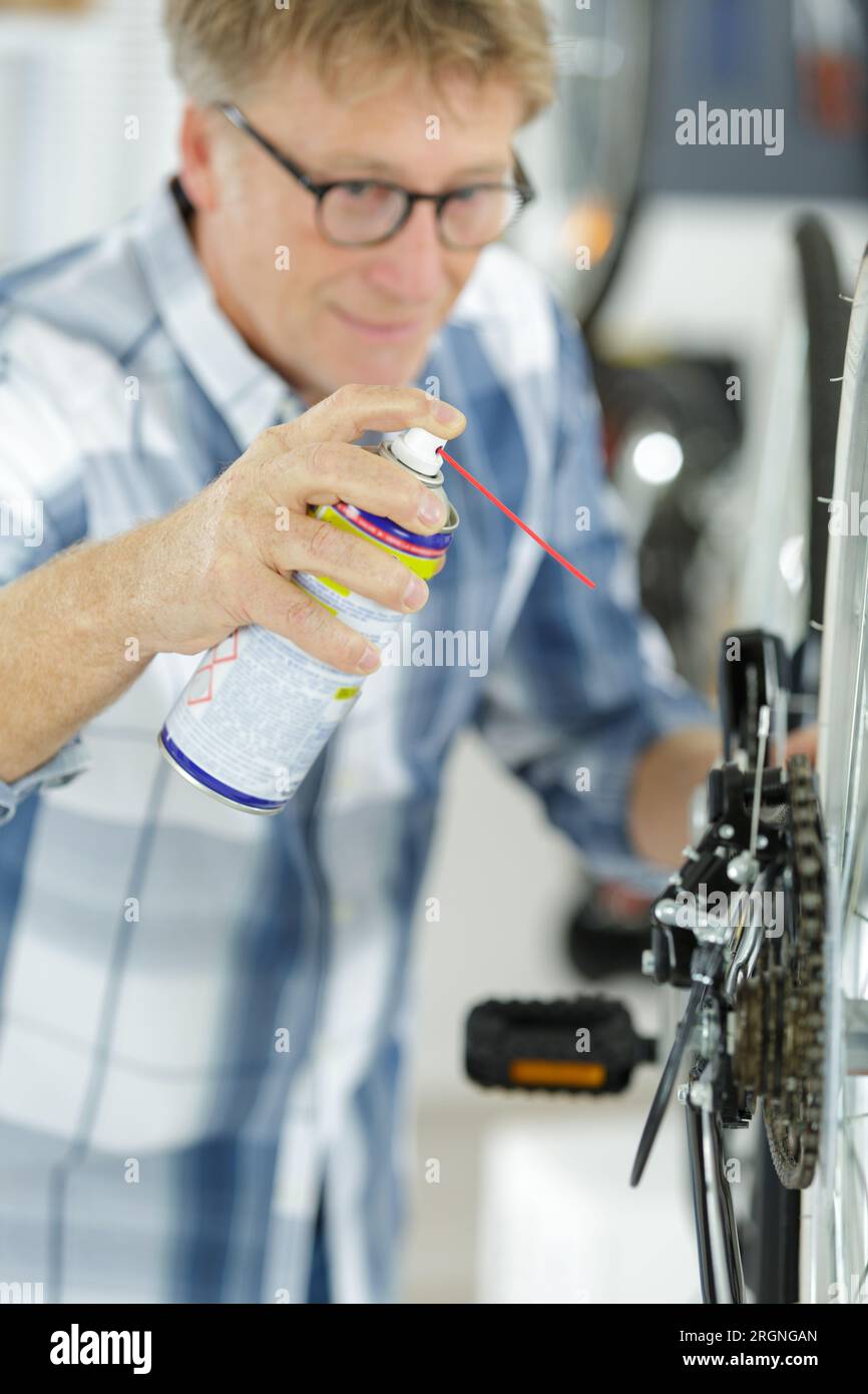 technical expertise taking care a gear bicycle shop Stock Photo Alamy