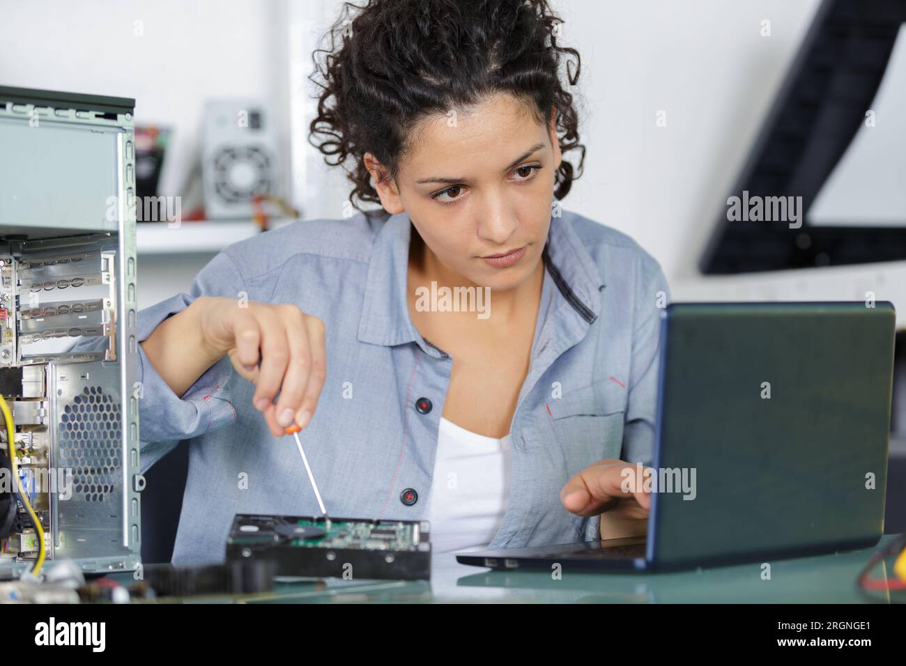 fixing a laptop hard drive Stock Photo - Alamy