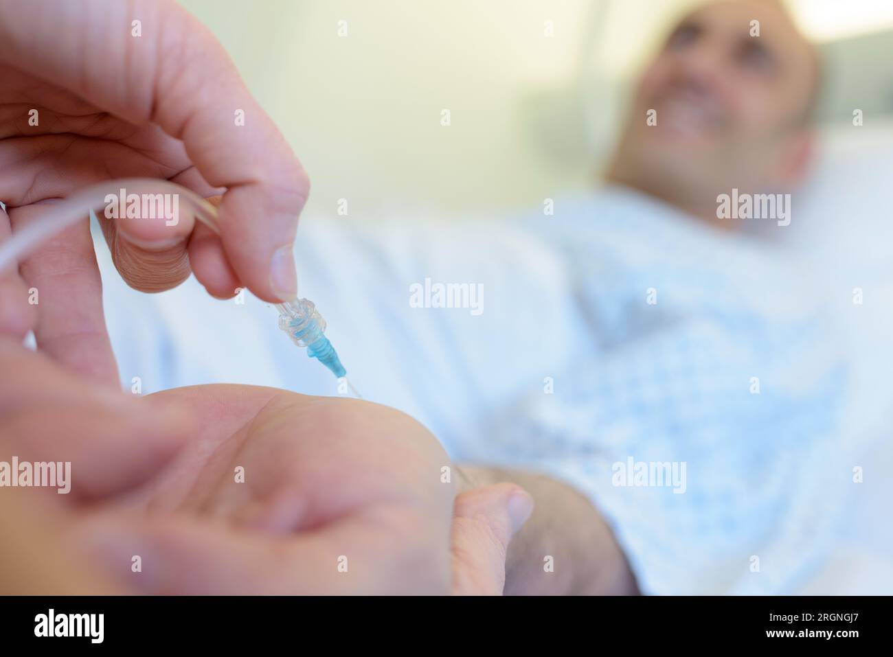 plastic surgeons hand holding syringe for injection Stock Photo Alamy