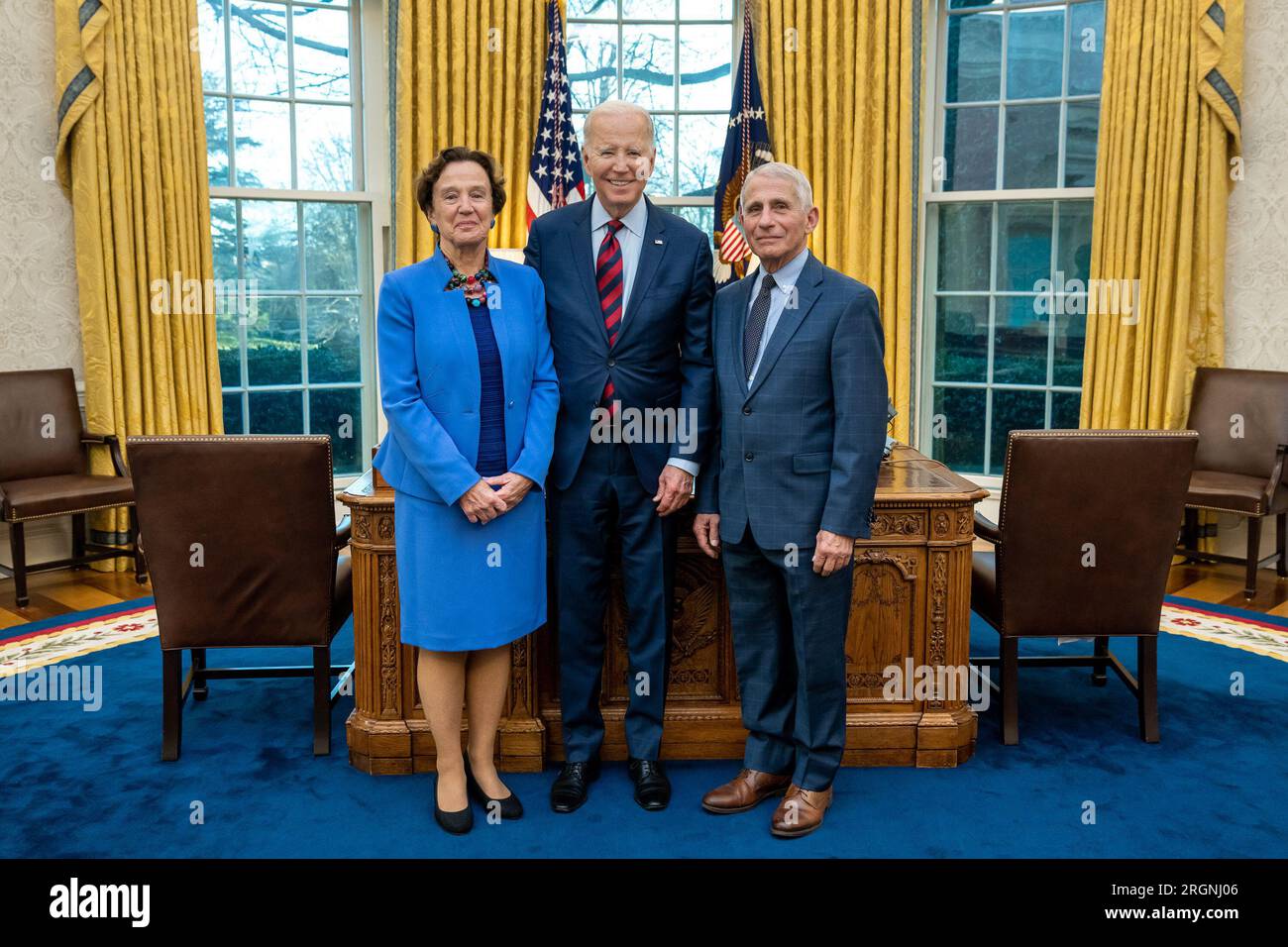 Reportage: President Joe Biden greets his former Chief Medical Adviser Dr. Anthony Fauci and his wife Dr. Christine Grady, Tuesday, January 24, 2023, in the Oval Office. Stock Photo