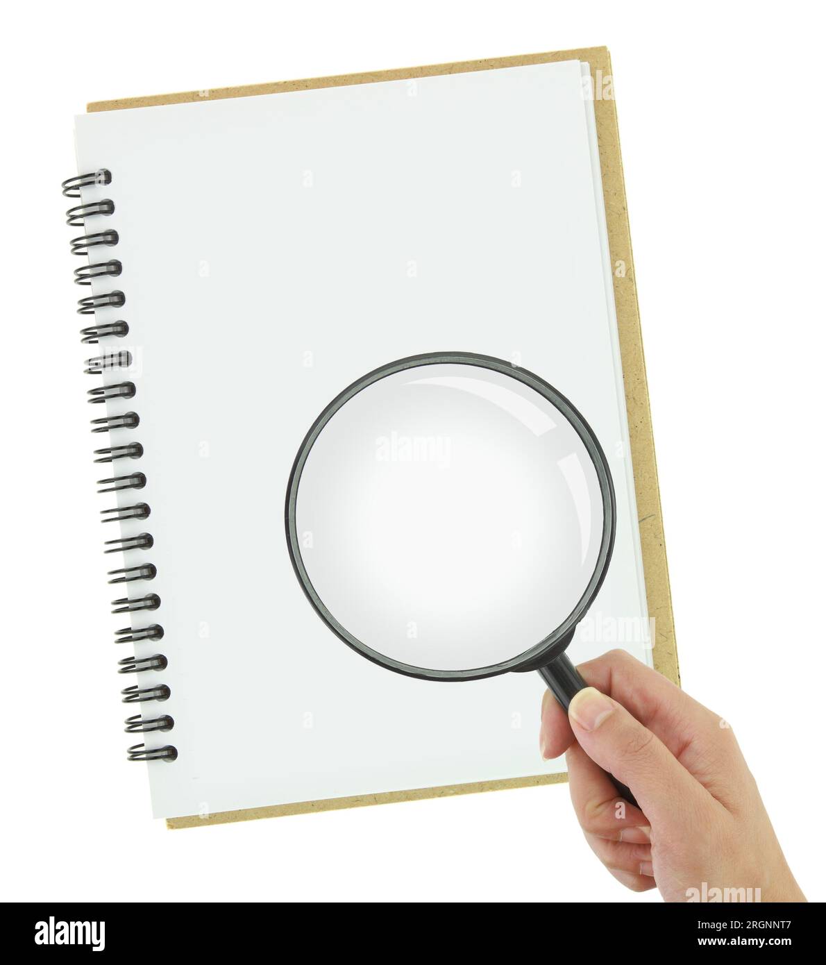 Hand holding magnifying glass over a notebook isolated on white transparent background, top view Stock Photo