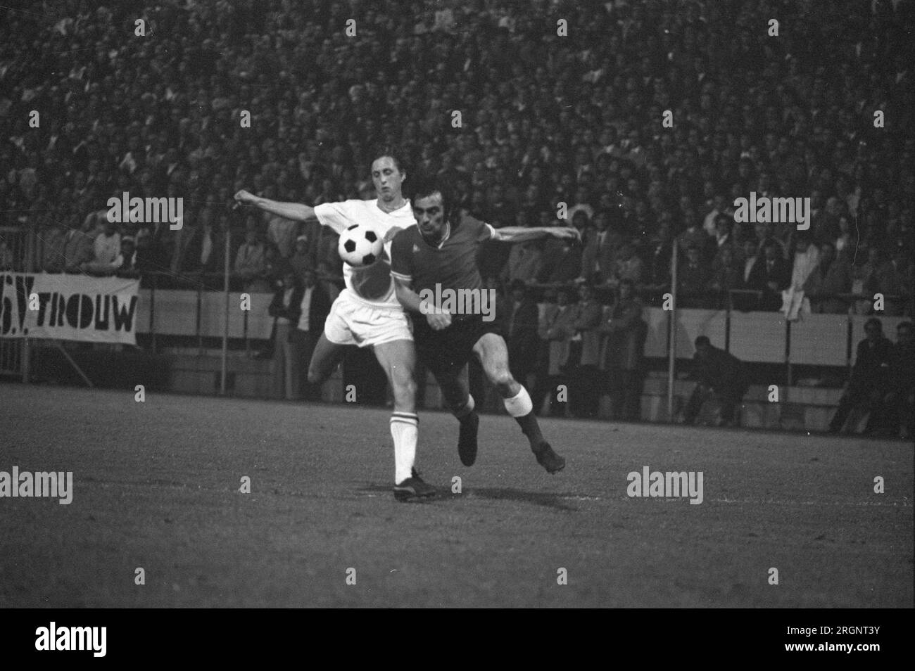 PSV against Ajax 0-3, Cruijff (left) and P. Strik in action; ca. September 1972 Stock Photo
