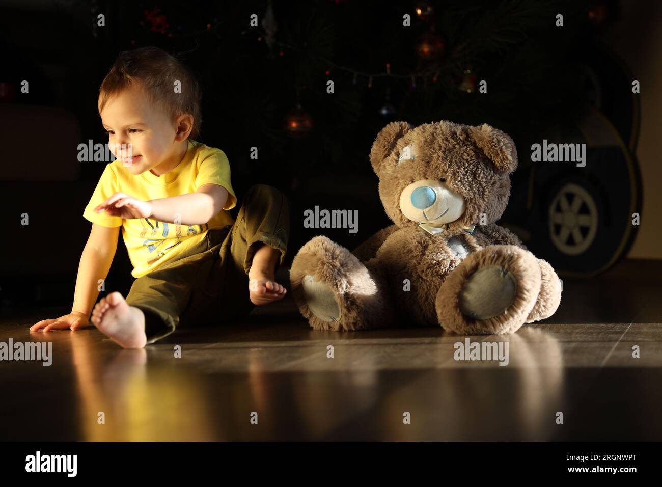 Cute little boy playing with toy Teddy bear Stock Photo - Alamy