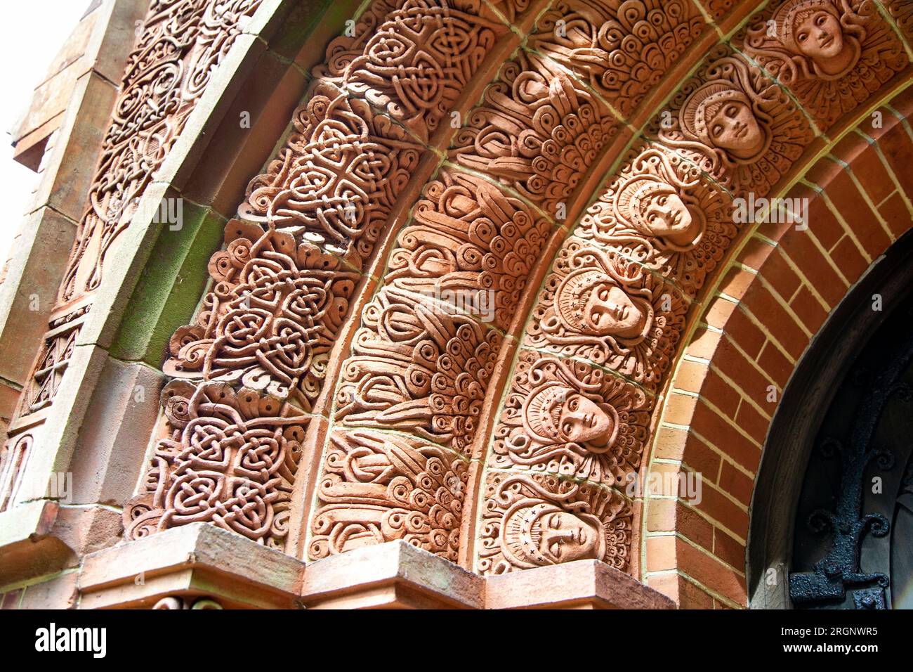 Celtic and art nouveau style relief in the doorway archivolt of the Watts Chapel, Compton, Surrey, England Stock Photo