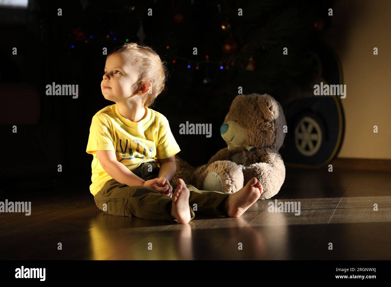 Cute little boy playing with toy Teddy bear Stock Photo - Alamy