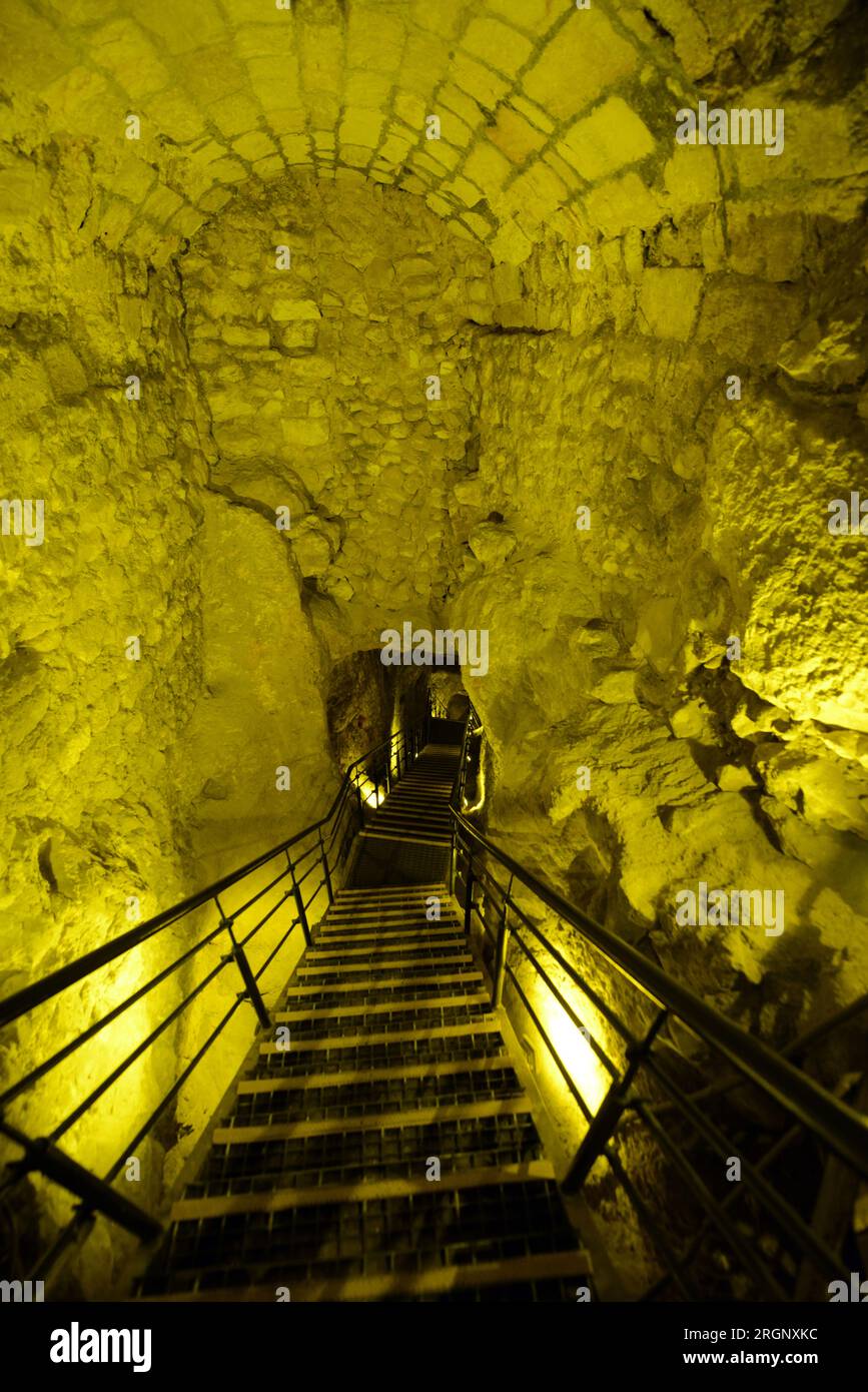 Walking in the Siloam tunnel A water tunnel that was carved within
