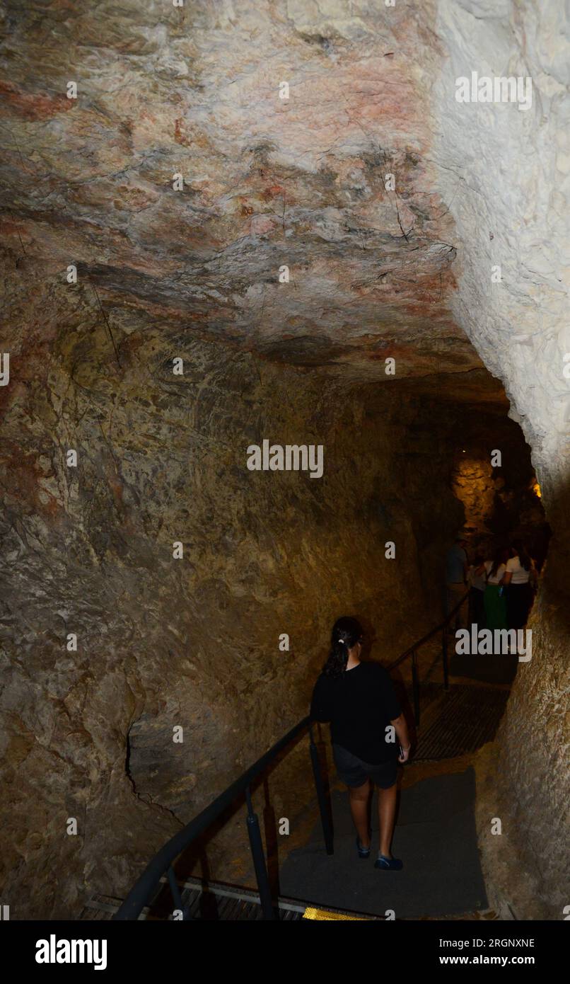 Walking in the Siloam tunnel A water tunnel that was carved within
