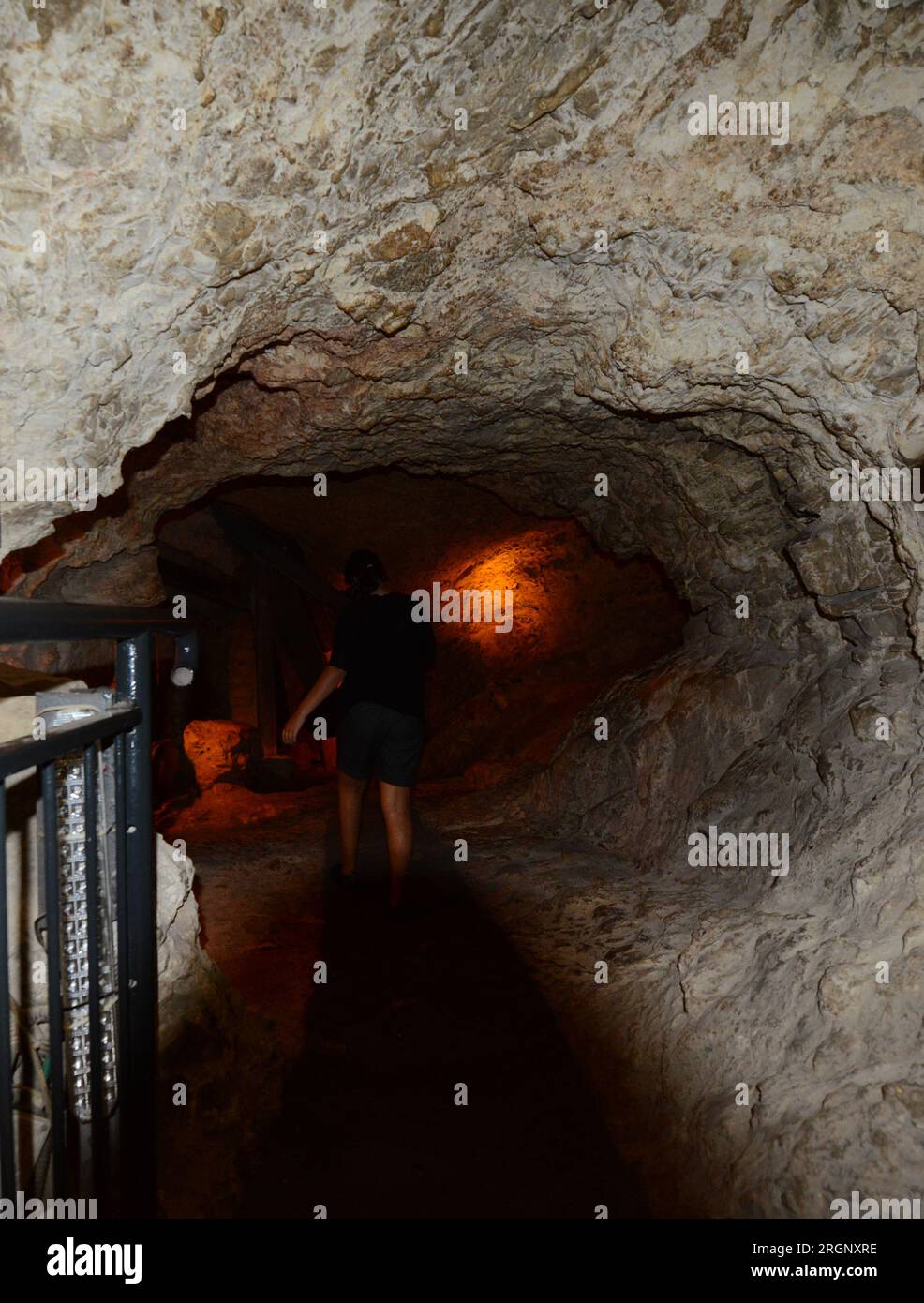 Walking in the Siloam tunnel A water tunnel that was carved within