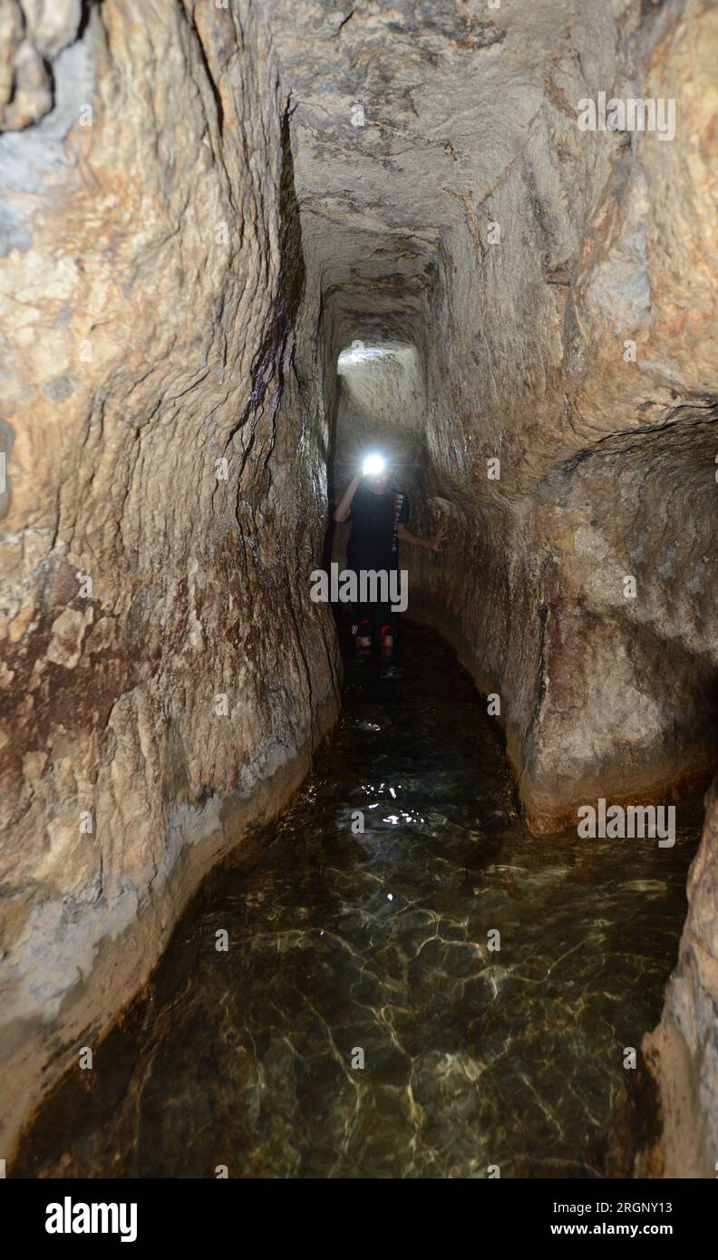 Walking in the Siloam tunnel A water tunnel that was carved within
