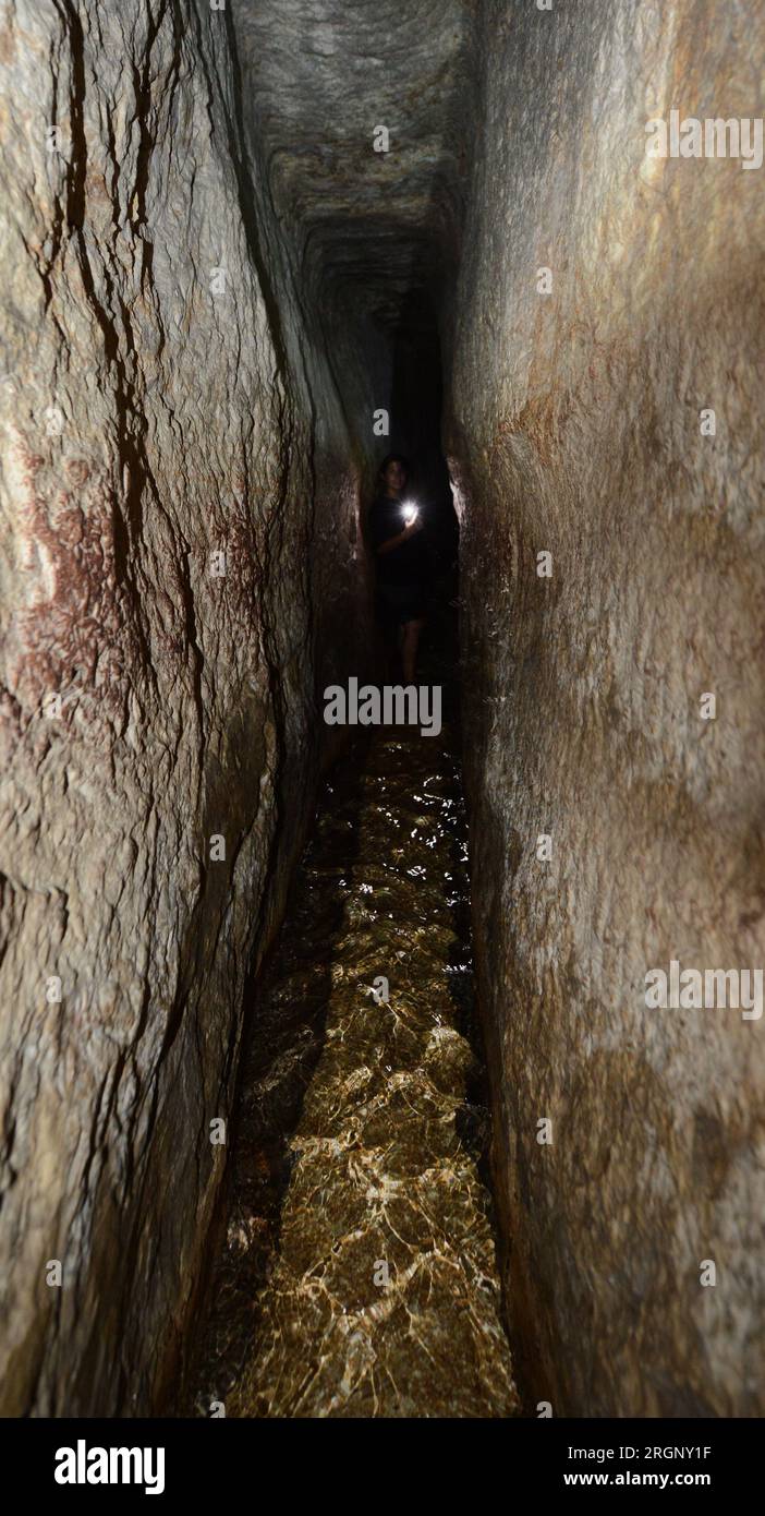 Walking in the Siloam tunnel A water tunnel that was carved within