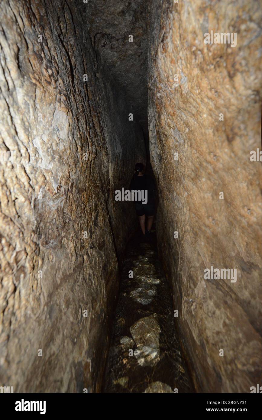 Walking in the Siloam tunnel A water tunnel that was carved within